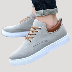 Dam sneakers i tyg med snörning låg modell